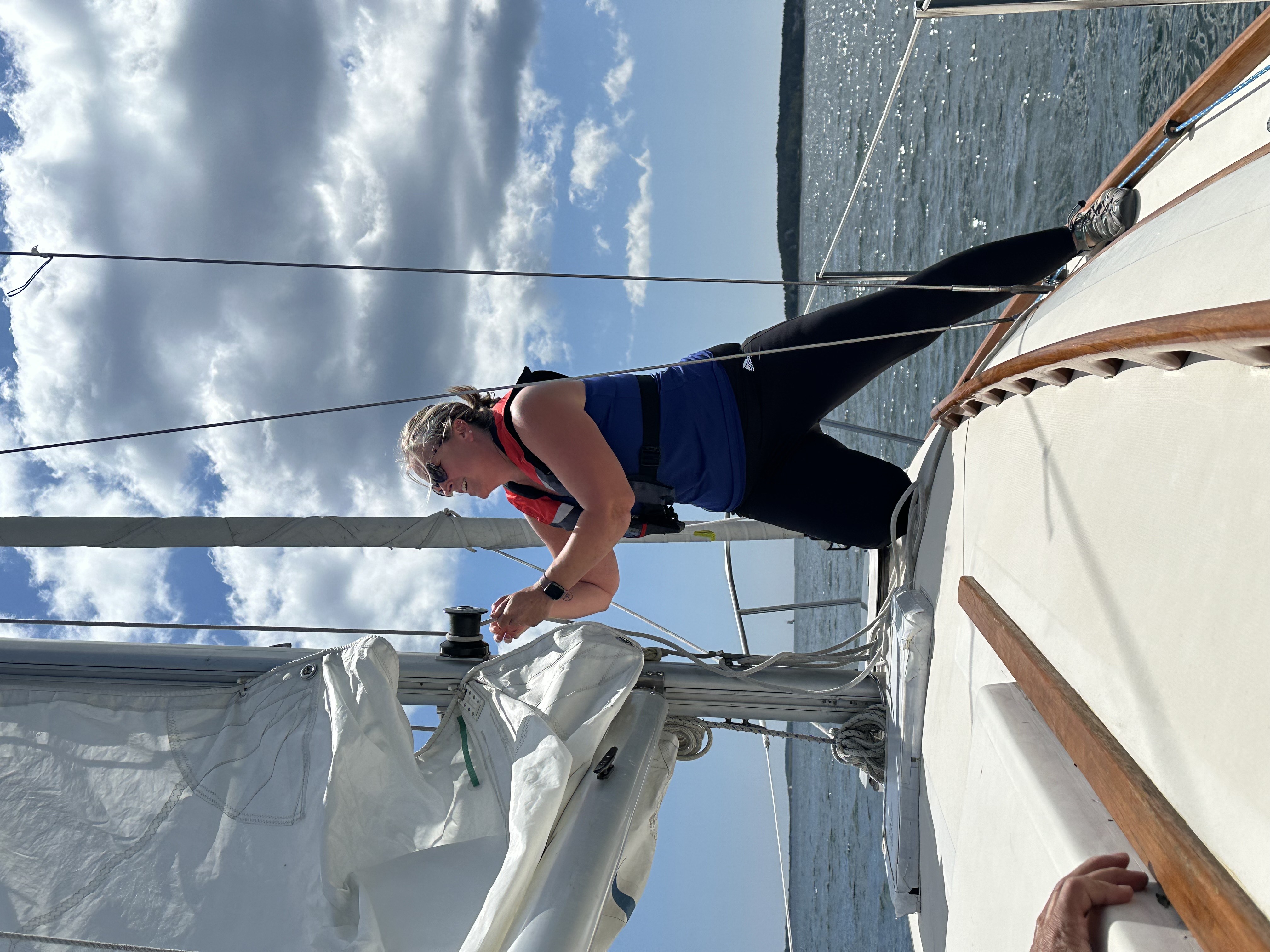 Teacher hoisting sail